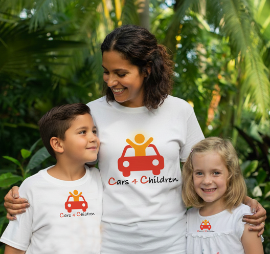 A mother holding her two children, safe and smiling